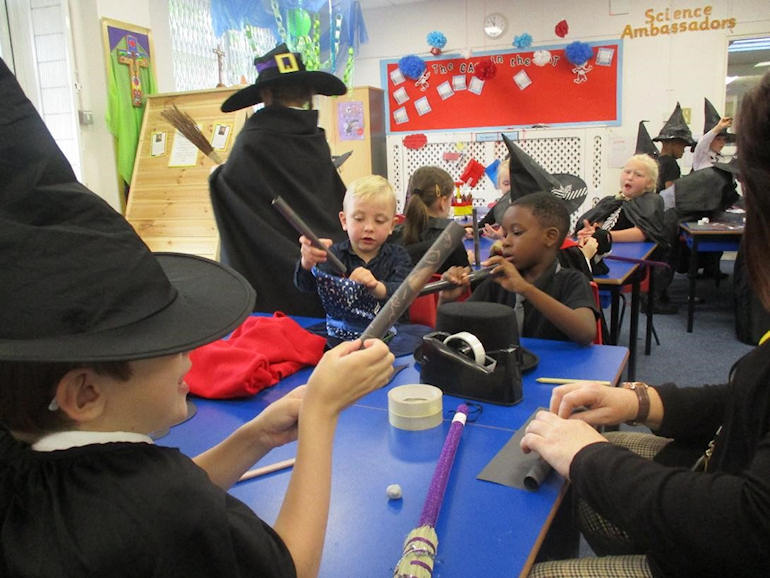 Children dressed as witches in Art Club