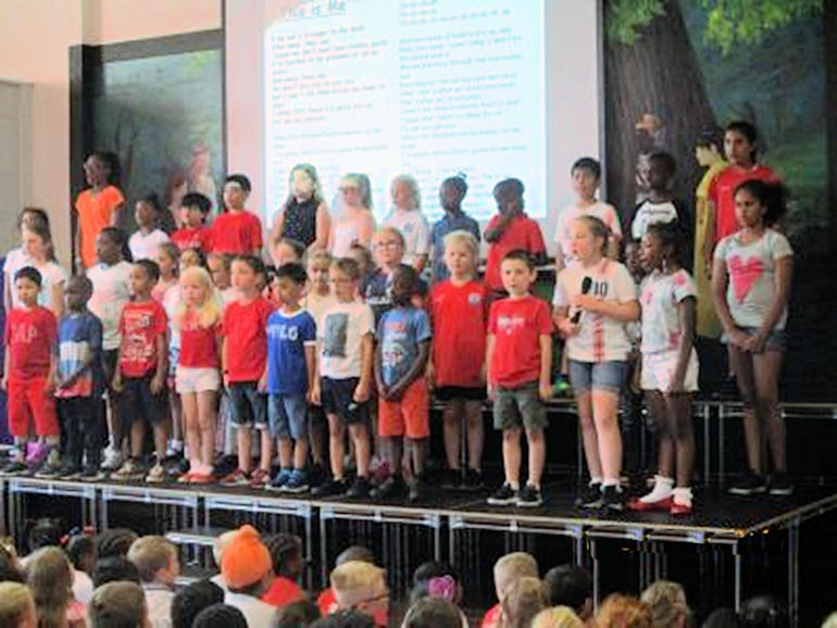 Choir singing in assembly