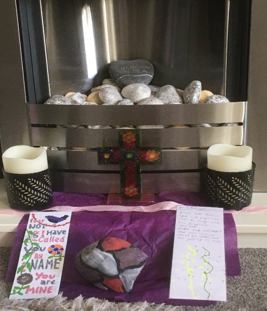 Children using their prayer boxes at home
